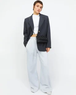 Bolso mini acolchado con detalles metálicos