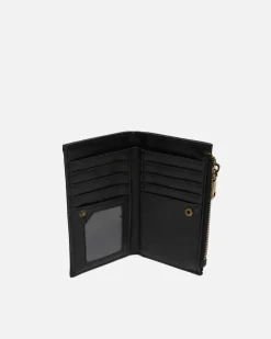 Monedero pequeño con detalles metálicos